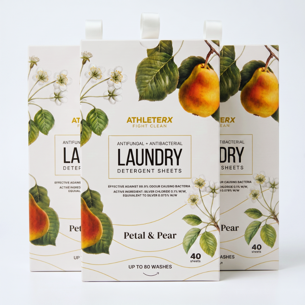 Three boxes of AthleteRx Light Clean Laundry Detergent Sheets in the Petal & Pear scent, arranged in a fan-like stack on a white background.