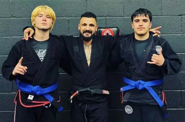 3 people in black jiujitsu gi